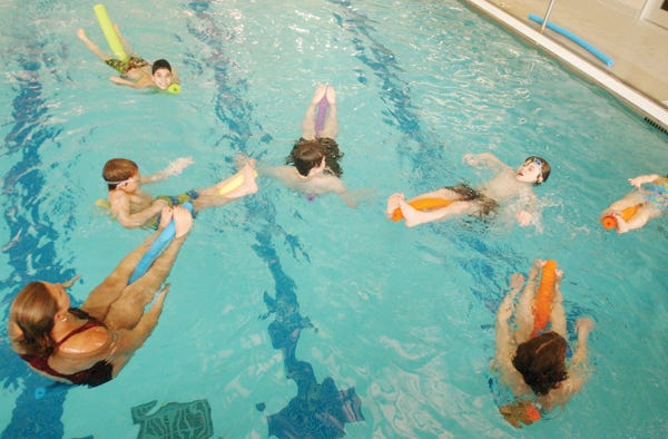 Participants in the Turbo Teen program perform exercises in the pool at the YMCA in Canan-daigua. The Y is increasing its focus on fitness for young people