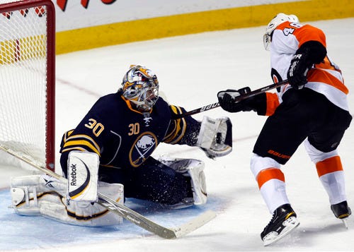 Buffalo Sabres goalie Ryan Miller, left, stops a shot by Philadelphia Flyers' Danny Briere (48) during the third period of Game 4 of a first-round NHL Stanley Cup playoffs hockey series in Buffalo, N.Y., Wednesday, April 20, 2011. The Sabres won 1-0. (AP Photo/Devin Duprey)