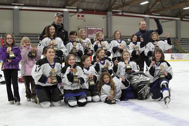 Courtesy photo
The Seacoast Lightning U-10 team was recently crowned champion of the Middlesex Yankee Conference Girl's Hockey League Mid North Division, upsetting top-seeded Wellesley by the score of 4-2. In the front, from left, are Sarah Gallo, Dakota Markey, Emma Connor, Robin Potter, Maddox Angerhofer, Erin Irons, Alyssa Civiello, (middle) Molly Pine, Kristina Allard, Ashley Keaveney, Carissa Towlson, Kate Irons, Bridget Babcock, Katie Kopecky, Kyla MacLaughlin, Grace Allen, (back) coaches Kevin Keaveney and Doug Allen. Seacoast went 3-0 in the tournament, beating Reading, 5-4, in overtime in their opener after trailing 4-0, and then topping Lynn, 3-1.