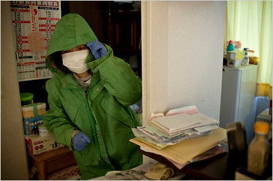 Michiko Koyama, whose house is near the Fukushima Daiichi nuclear plant, returned home with her husband, Nobuo, to retrieve their belongings.