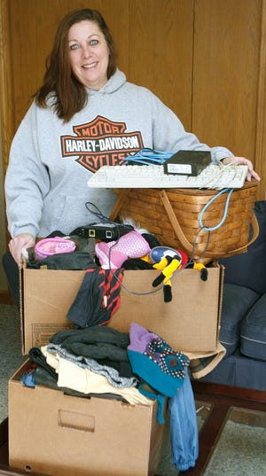 Ann O'Toole of Plain Twp is shown with some of the items she has collected up from her home for the Freecycle network.