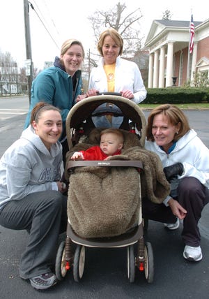 Colleen Colburn of Holbrook, left; her son Benjamin, 1, (in stroller); Jane Feroli of Bridgewater, top right; Megan Hennessey, left of stroller; and her mother, Pat Hennessey, right of stroller, both of Bridgewater. The Good Friday Walk, sponsored by the Bridgewater Council of Churches, was held Friday, April 22, 2011, and proceeds raised from the walk will help feed the hungry.