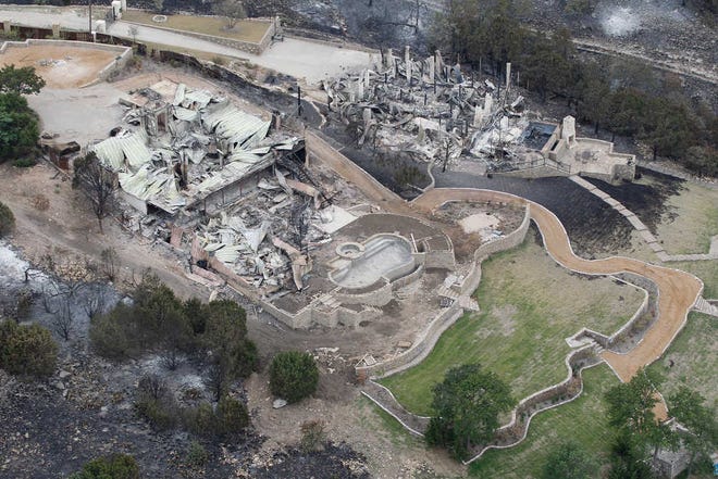 This aerial photograph shows a large home left in ashes on Possum Kingdom Lake. The fire at Possum Kingdom Lake is among several that have scorched about 1 million acres across bone-dry Texas in the past two weeks.