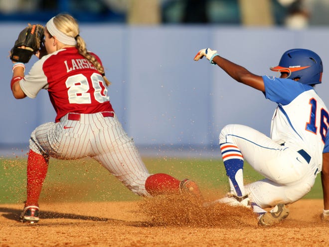 Florida’s Michelle Moultrie safely slides into second ahead of the tag by Alabama infielder Whitney Larson during the fifth inning of Friday’s game in Gainesville, Fla. Alabama won, 5-0.