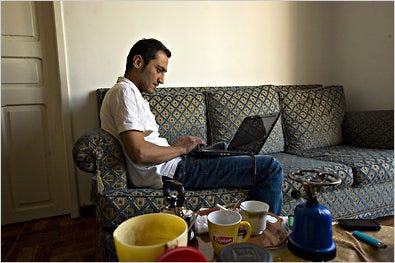 Rami Nakhle, a Syrian dissident hiding in Beirut, coordinated coverage of protests in Syria on Friday from his apartment.