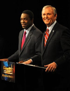 Mayoral candidates Alvin Brown and Mike Hogan prepare for the debate at the WJXT studios on Monday. They both promised to create jobs, to fight crime and not to raise taxes. The primary area of disagreement was whether to have more debates.