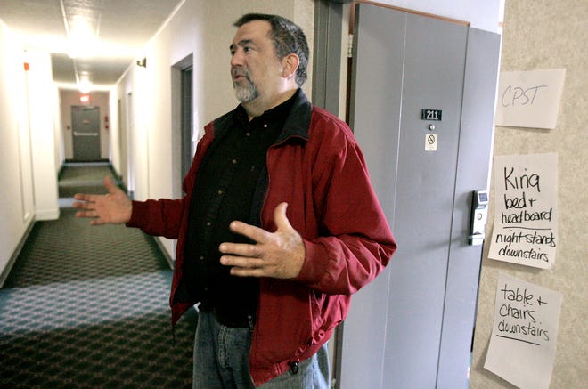 Director Ray Fete stands in the hallway of Family Living Center’s new facility, where each room is clearly marked to what has been done, where the furniture goes and the use for which it is designated.