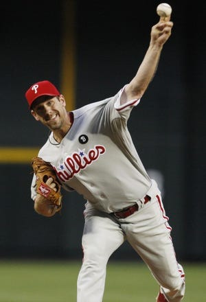 Cliff Lee throws against the Arizona Diamondbacks during the first inning of the game Monday in Phoenix.