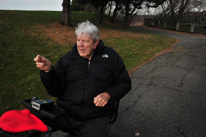 World War II Veteran and Freedom Village resident Bob Olson points out where he was attacked while he was out getting air on his electric scooter last fall. Olson was attacked by a man on the Window On The Waterfront pathway.