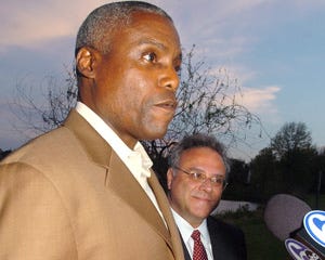 Nine-time Olympic gold medalist Carl Lewis of Medford, accompanied by his attorney, William Tambussi of Westmont, talks to the media regarding Secretary of State Kim Guadagno’s decision to remove Lewis from the June primary ballot. He has filed a lawsuit in federal court that seeks to overturn her order.