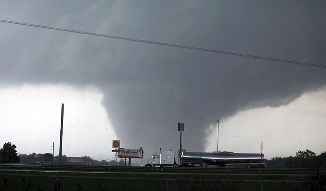 A tornado Wednesday rips through Tuscaloosa, a city of more than 83,000 and home to the University of Alabama.