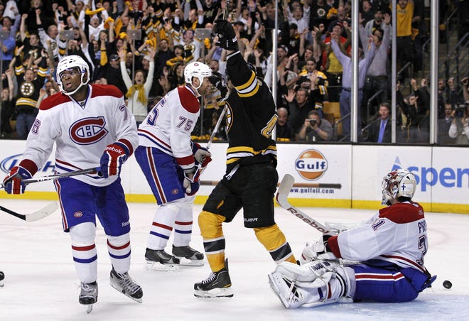 Montreal Canadiens goalie Carey Price, right, defenseman P.K. Subban, left, and defenseman Hal Gill react as Boston Bruins' David Krejci celebrates the game-winning goal by teammate Nathan Horton during the overtime period of Game 7 in a first-round NHL Stanley Cup hockey playoff series in Boston Wednesday, April 27, 2011.