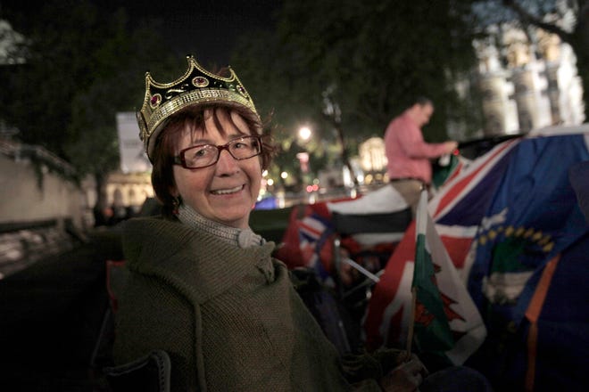 Royal enthusiast Margaret Ford, from Wales, camps across the street from Westminster Abbey on Wednesday, April 27, 2011, to ensure having a prime viewing spot for the royal wedding of Prince William and Kate Middleton in central London.