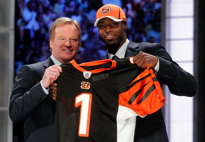 Jason DeCrow/The Associated Press Georgia wide receiver A.J. Green, right, holds up a jersey with NFL commissioner Roger Goodell after he was selected as the fourth overall pick by Cincinnati in the first round Thursday in New York.