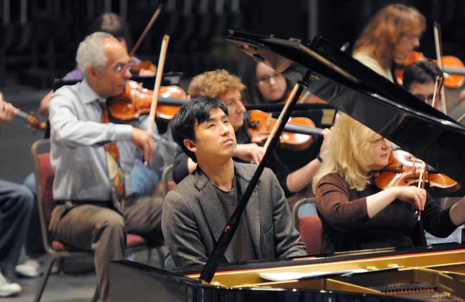 Guest pianist Julius Kim rehearses Johannes Brahms' First Piano Concerto with the Topeka Symphony Orchestra for its season finale at 7:30 p.m. Saturday in White Concert Hall.