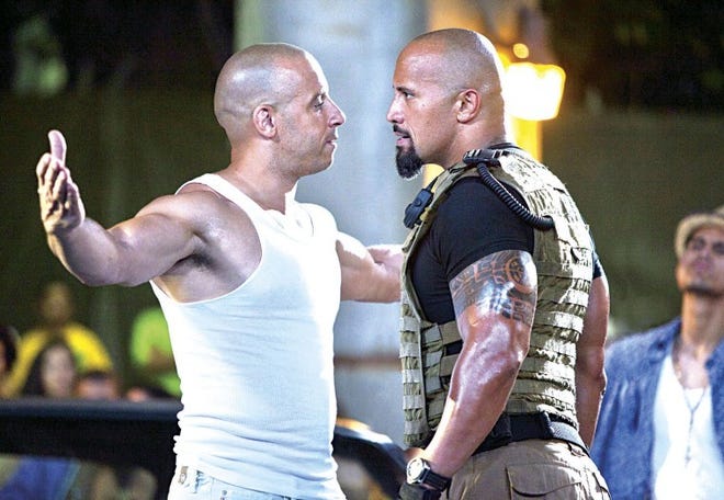 Vin Diesel (left) clashes with Dwayne Johnson in "Fast Five."