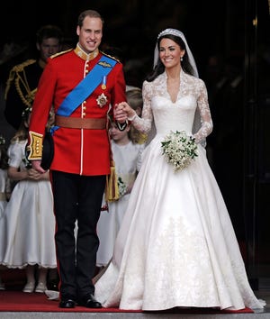Britain's Prince William and his wife Kate, Duchess of Cambridge stand outside of Westminster Abbey after their Royal Wedding in London Friday, April, 29, 2011.