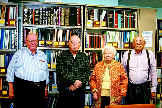 Don Perrin, Tim Denisin, Ruth Kinney and Dean Sandstrom pose at the 30th anniversary genealogy society meeting. The four have been involved with the society since its inception.