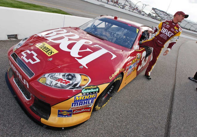 Clint Bowyer gets out of his car during qualifying runs for the NASCAR Sprint Cup auto race at Richmond International Raceway in Richmond, Va., Friday, April 29, 2011. (AP Photo/Steve Helber)