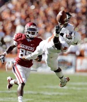 Texas cornerback Aaron Williams (4) reaches for a pass in front of wide receiver Oklahoma Ryan Broyles (85) during the first half of an NCAA football game at the Cotton Bowl in Dallas. The Buffallo Bills used their second-round draft selection on the corner/safety hybrid.