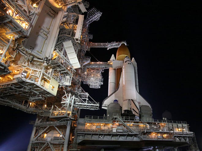 In this photo provided by NASA, the space shuttle Endeavour sits on Launch Pad 39-A at the Kennedy Space Center in Cape Canaveral, Fla., Friday, April 29, 2011. Friday's launch attempt was scrubbed due to a faulty power unit heater. (AP Photo/NASA, Kim Shiflett)