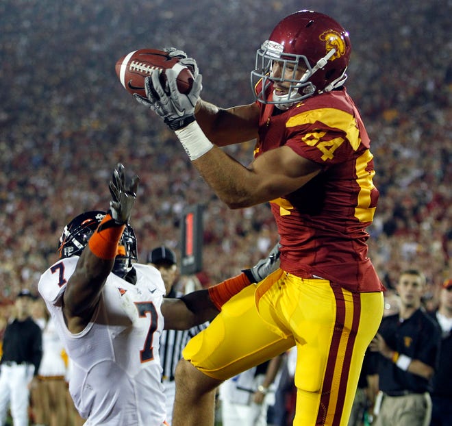 Southern California's tight end Jordan Cameron (84) catches a touchdown pass over Virginia's safety Corey Mosley (7) in the first half of a game in Los Angeles on Sept. 11, 2010. The Cleveland Browns selected Cameron in the fourth round of the 2011 NFL Draft.