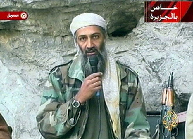 In this Oct. 7, 2001, file photo from a television image, Osama bin Laden is seen at an undisclosed location.