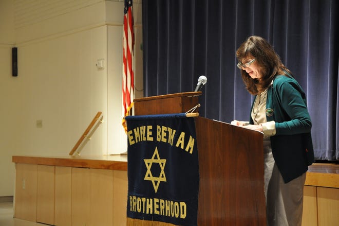 Joanna B. Michlic speaks to audience members about the lives of young Holocaust survivors in Poland following World War II during Sunday's Temple Beth Am presentation in Framingham.