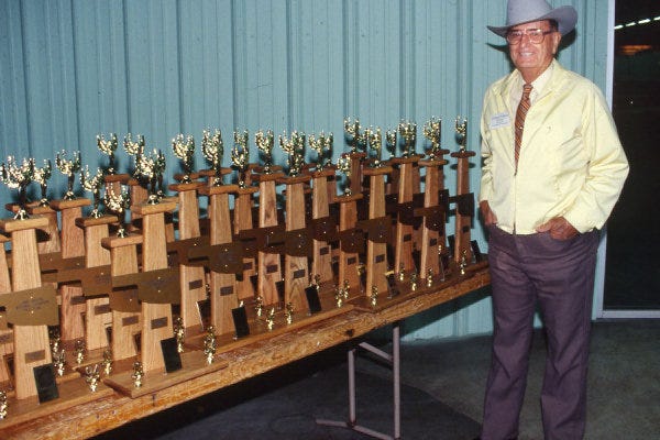 Russell Pierson is shown here in 1994 next to trophies for the National Land and Range Judging Contest in Oklahoma.
 Provided - Photo provided