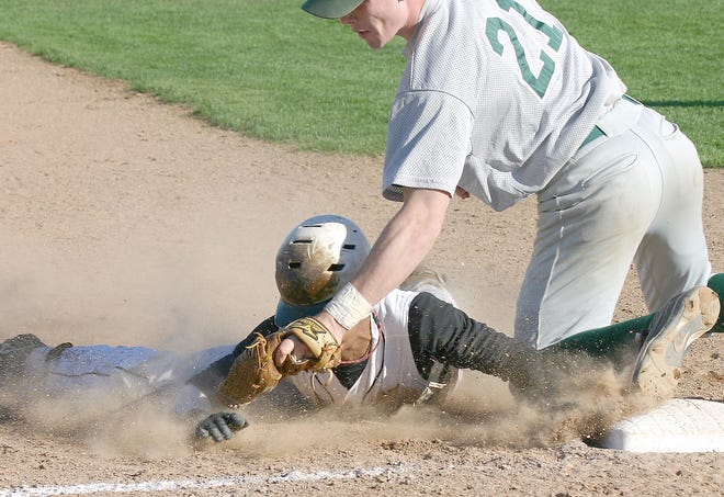Herkimer County Community College General Devin Warmack slides into a tag by Hudson Valley Community College third baseman Luke Burns during the second game of Saturday’s doubleheader.