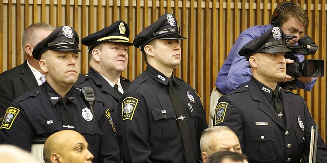 Members of the Randolph police force attend the Law Day ceremonies at Quincy District Court honoring dozens of police officers from the area for their heroism. Seven police officers from Randolph were honored Wednesday for their valor in the line of duty.