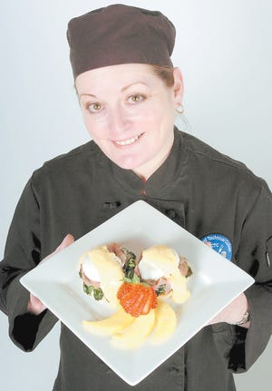 Wendy Helm with her Eggs Benedict Florentine, a perfect treat for Mom on her day. By PETER WILLOTT, peter.willott@staugustine.com
