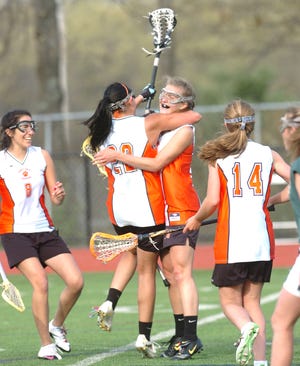 Time to celebrate as Jocelyn Paul, center, is all smiles after scoring her 200th career goa during their game on May, 06, 2011 in Easton. Her teammates from left are Sophie Kagan, Kellianne Doherty, and Kristina Simonson.
