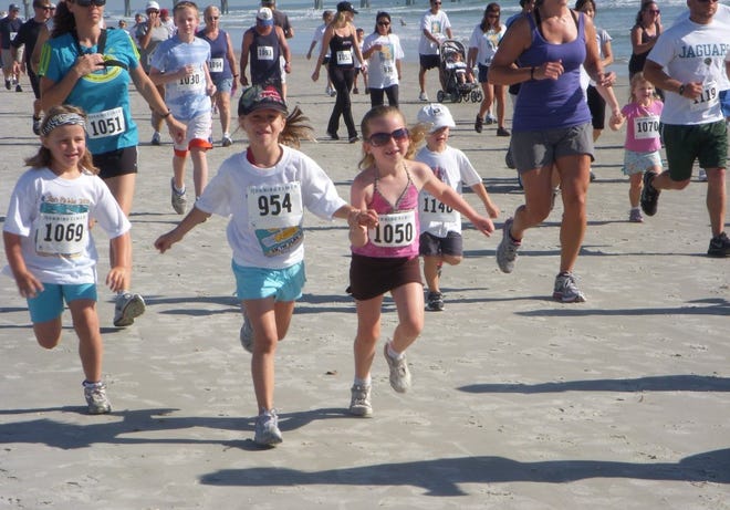 Young runners take off at the start of the fourth annual San Pablo Elementary 5K for Play on April 30. The Duval County health and fitness magnet school uses the race to promote good health and fitness habits at an early age.