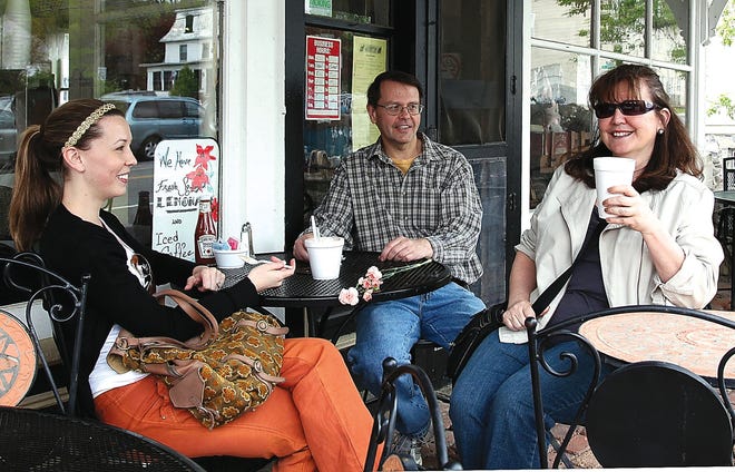 Photo by Sara Hudock-Cole/New Jersey Herald 
Jane Murawski of Parsippany, right, enjoys a cup of coffee with her husband, Jim, center, and daughter, Debbie, left, on Mother’s Day at the Millside Cafe in Lafayette.