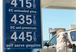 In this photo taken May 5, 2011, a woman fills up her vehicle at an Arco gas station in Mill Valley, Calif.