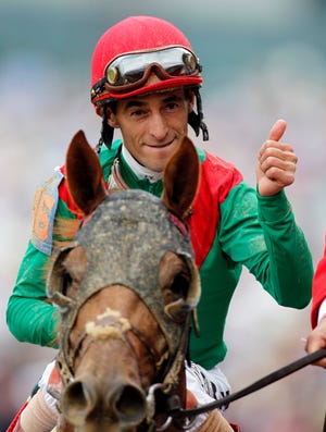 John Velazquez, riding Animal Kingdom, reacts after winning the 137th Kentucky Derby on Saturday,