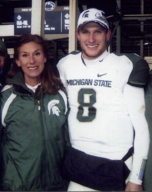 Contributed
Kirk Cousins stands with his mother, MaryAnn Cousins.