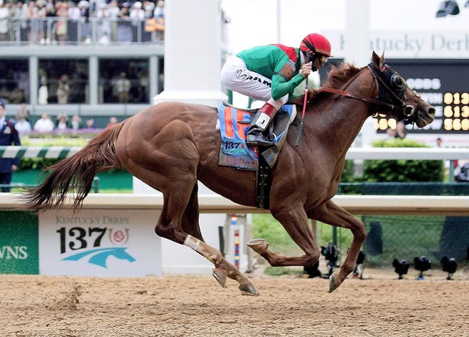 John Velazquez rides Animal Kingdom to victory during the 137th Kentucky Derby horse race at Churchill Downs Saturday.