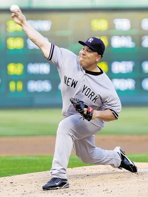 New York Yankees starting pitcher Bartolo Colon throws during the first inning of a baseball game against the Texas Rangers, Saturday, May 7, 2011, in Arlington, Texas. (AP Photo/LM Otero)
