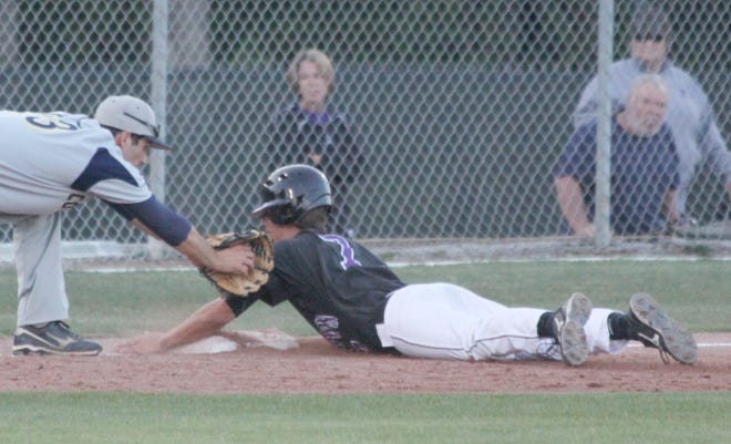 Dutchtown senior Austin Cheatwood slides safely into third base against Covington in the opening round of the Class 5A baseball playoffs last week.