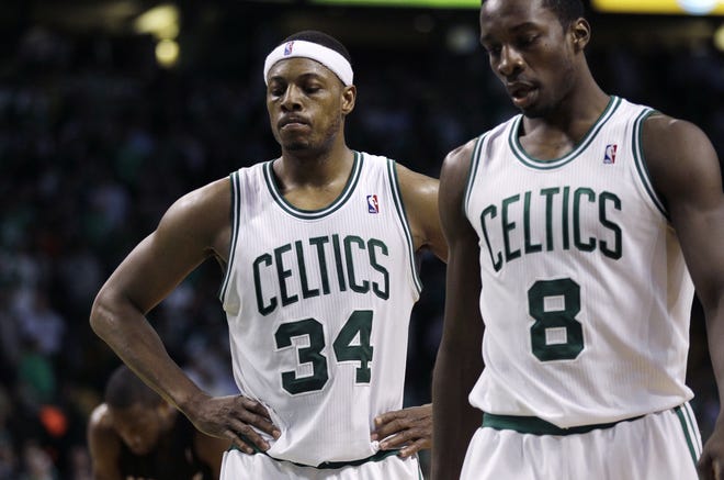 Paul Pierce, left,and Jeff Green hang their heads during overtime of the Celtics' loss to the Heat on Monday night.