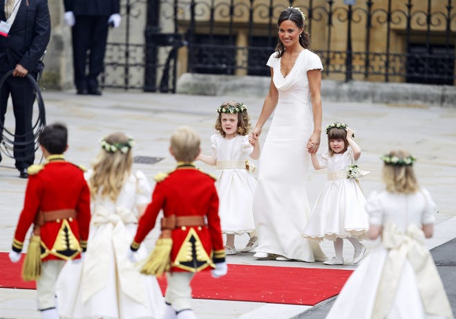 Maid of honour Pippa Middleton arrives with ring bearers Westminster Abbey at the Royal Wedding in London Friday, April 29, 2011. (AP Photo/Alastair Grant)