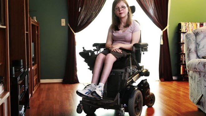 Joanne Marszal, 23, is a college student at Florida Atlantic University in Boca Raton. Born four months premature, Joanne suffers from Cerebral Palsy and is in a wheelchair. Joanne said many of the automatic doors on campus don't work and that she often has to bang into the door with her wheelchair's metal footrest to open them.