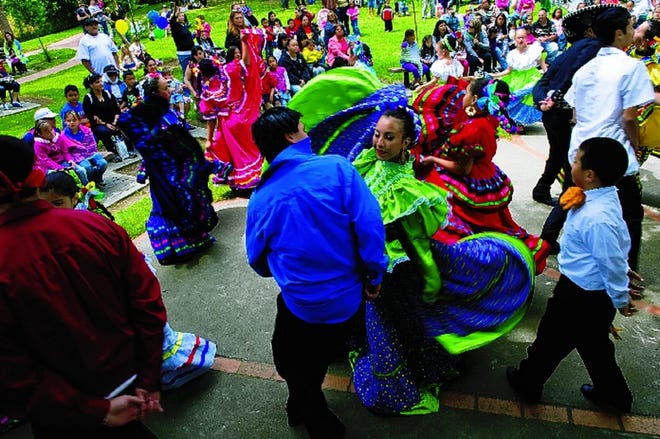 Members of the Stockton-based Los Danzantes Del Puerto perform a Mexican ballet folkloric dance Saturday at Pixie Woods during the 22nd annual Children and Youth Day hosted by the Family Resource & Referral Center.
