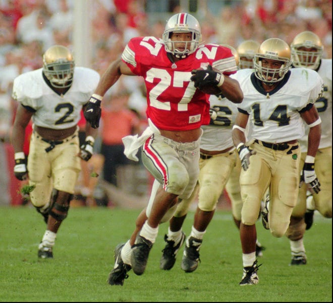 Ohio State's Eddie George (27) runs for a touchdown against Notre Dame in front of the Irish's Ivory Covington (14) and Kinnon Tatum (2) in a 1995 game. George was chosen to be inducted into the College Football Hall of Fame.