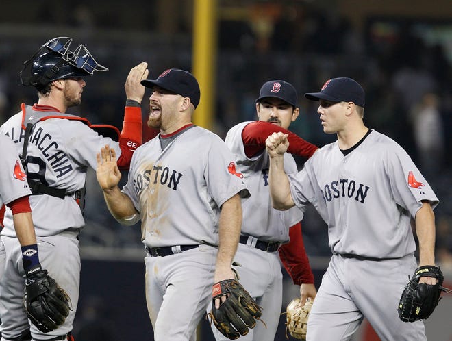 The Red Sox celebrate their sweep of the Yankees.