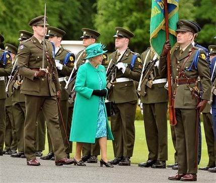 Britain's Queen Elizabeth II inspects an Irish Guard of Honour after arriving at Aras an Uachtarain (The Irish President's official residence) in Phoenix Park, Dublin, Tuesday May 17, 2011. The Queen set foot on Irish soil at the start of a historic state visit which will herald a new era in relations between Britain and the Republic. Politicians on both side of the Irish Sea have described the four-day event as momentous.