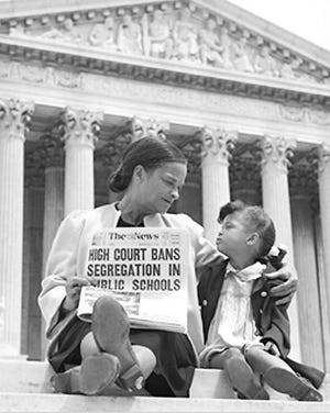 Nettie Hunt and her daughter, Nickie, sit on the steps of the U.S. Supreme Court in May 1954.
