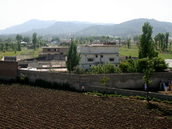 This May 3, 2011, file photo, shows a view of Osama bin Laden's compound in Abbottabad, Pakistan. U.S. officials briefed on the secret mission to get Osama bin Laden in Pakistan say the raid planners knew it was a one-shot deal. Those behind the raid predicted at the time that outrage over the breach of Pakistani sovereignty would make it impossible to try again if the raid came up dry. (AP Photo/Aqeel Ahmed)